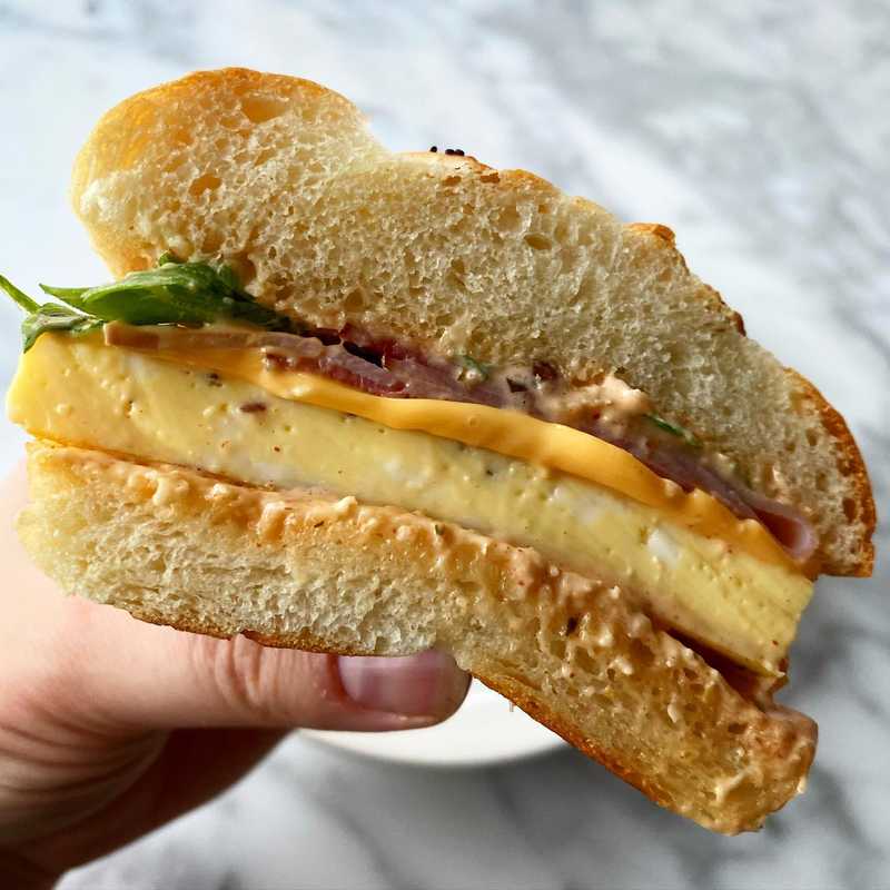Breakfast sandwich at home! Homemade Kaiser rolls with the egg “soufflé” technique (it’s not too hard! eggs and water! Baked low and slow in a bain-marie…
