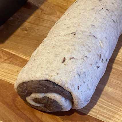 Roll the dough in a log and place it seam side down in your greased loaf pan. Even if you're skipping the darker dough this shaping step helps the loaf rise evenly. Cover and let prove a second time until the loaf is quite poofy. For my 10"x5" loaf pan it rises about to the top of the of the pan.