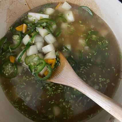 Pour in **4 cups stock** and add in the diced potatoes. Add additional liquid (water or stock) if needed to cover the potatoes. Bring to a boil, then reduce to a simmer, cover, and let cook for 10-15 minutes until the potatoes are fully cooked.